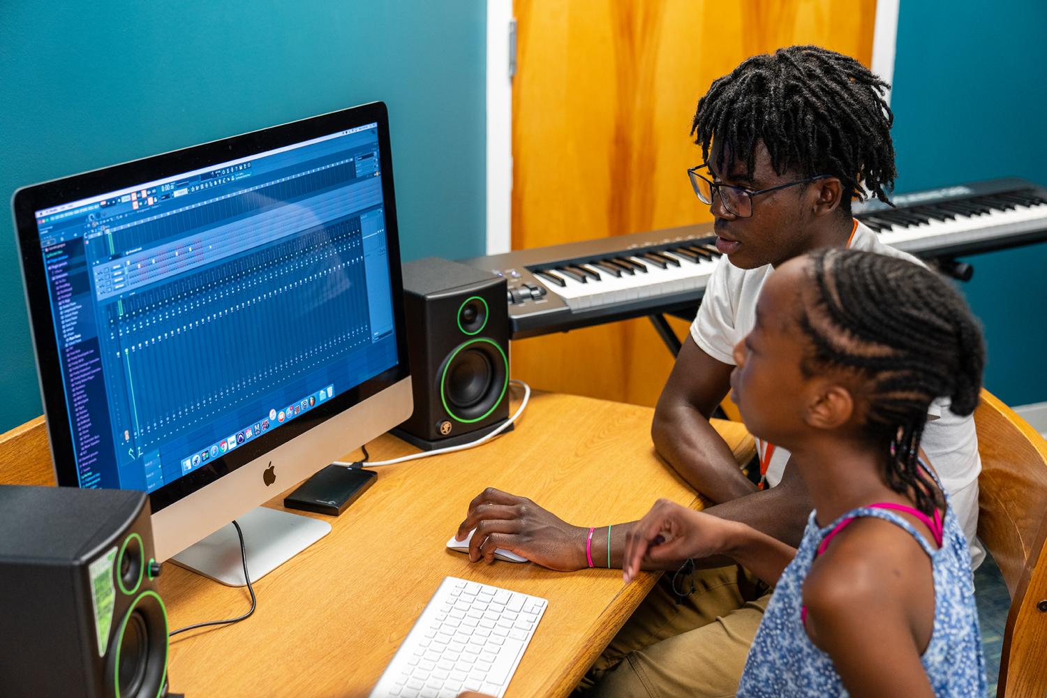 Teens using technology to produce music at the D.R.E.A.M. Lab
Production Camp at the Fairmount Heights Branch