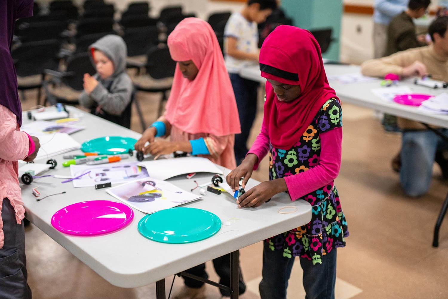 Children creating electric vehicles at a FutureMakers program at the Greenbelt Branch